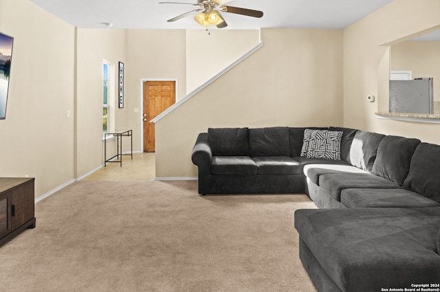 living room featuring ceiling fan and light carpet