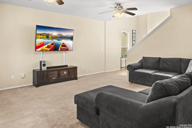 carpeted living room featuring ceiling fan