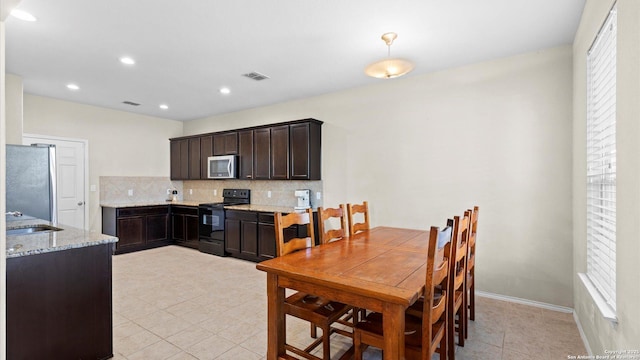 dining space featuring light tile patterned floors, baseboards, visible vents, and recessed lighting