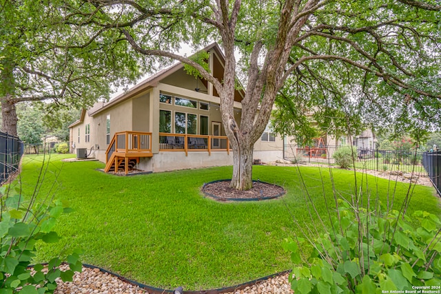 back of house with a lawn