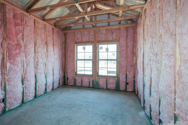 spare room featuring lofted ceiling