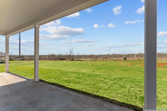 view of yard with a patio and a rural view