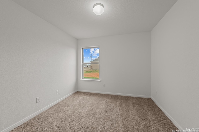 unfurnished room featuring carpet