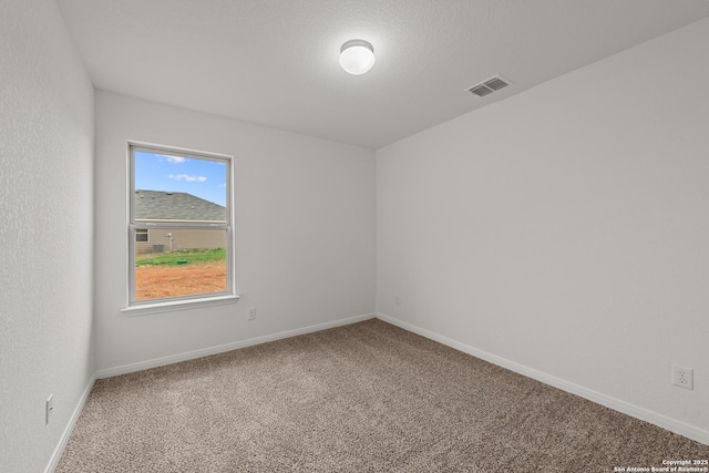 empty room featuring carpet