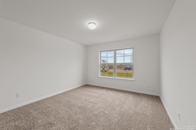 unfurnished room featuring carpet