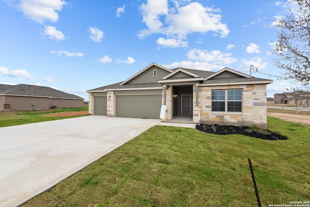 view of front of home with a garage and a front yard