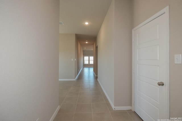 hallway with light tile patterned floors