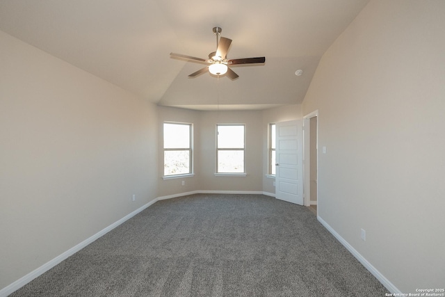 carpeted empty room featuring lofted ceiling and ceiling fan