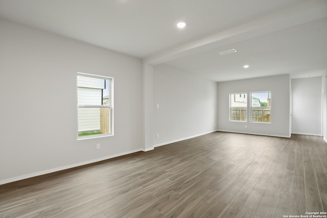 spare room with hardwood / wood-style floors