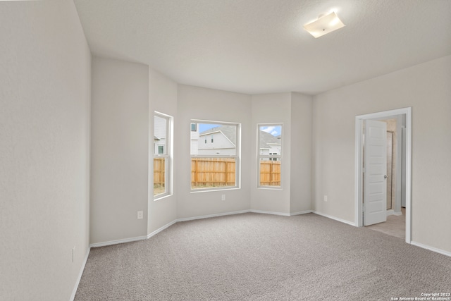 empty room featuring light carpet