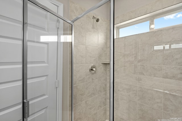 bathroom featuring an enclosed shower