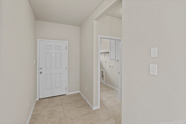 corridor with light tile patterned floors