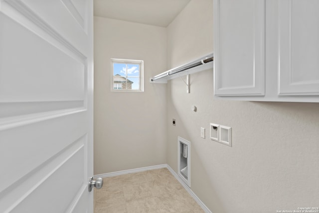 laundry room with electric dryer hookup, gas dryer hookup, light tile patterned flooring, and washer hookup