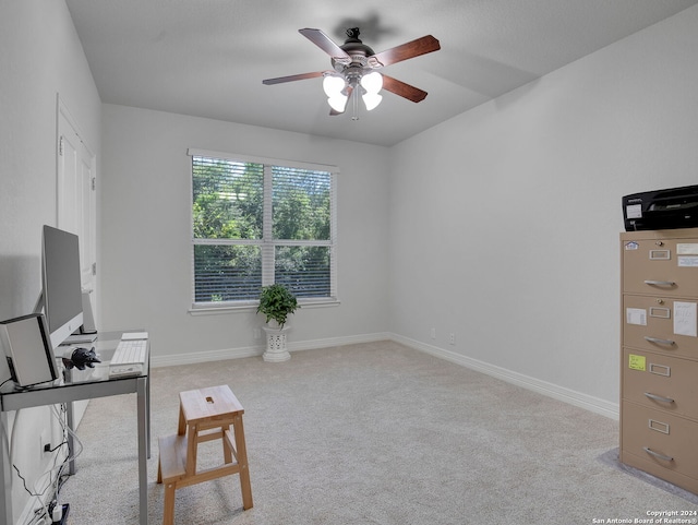 home office featuring light colored carpet and ceiling fan