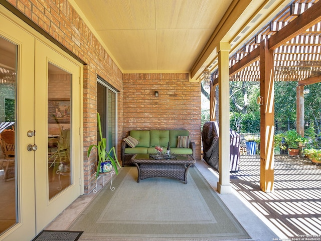 view of patio with a pergola and french doors