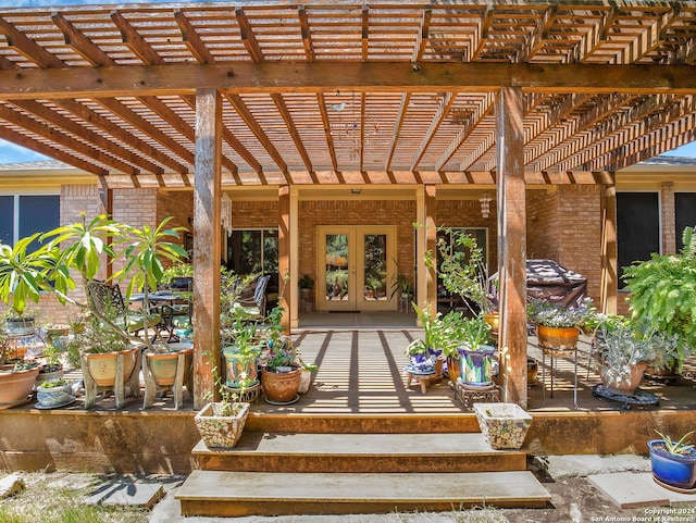 view of patio / terrace with a pergola and french doors