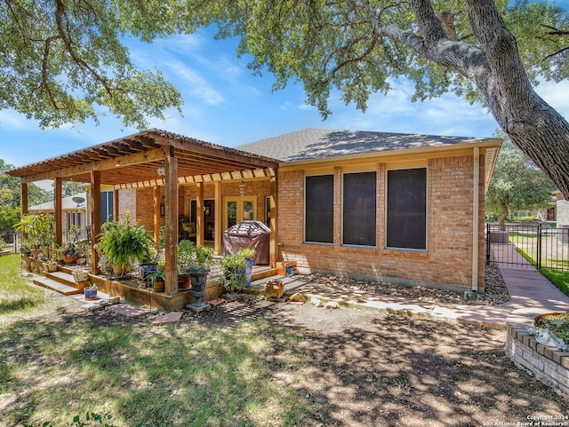 back of property with a pergola