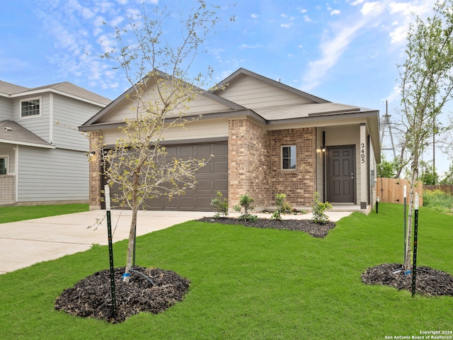 view of front of house featuring a garage and a front yard