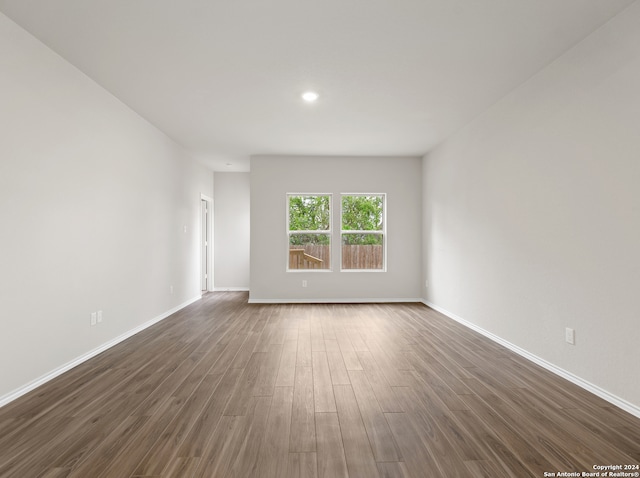 spare room featuring dark hardwood / wood-style flooring