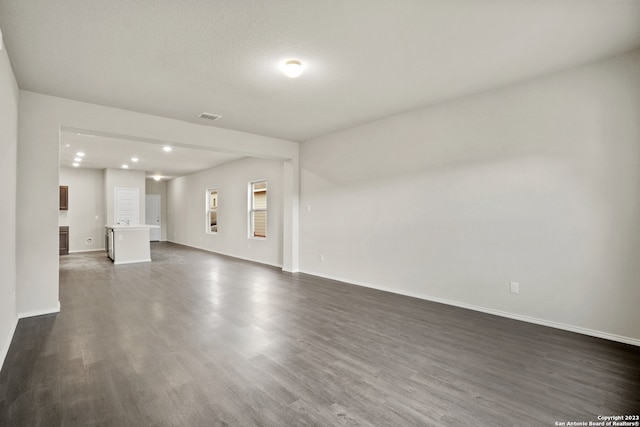 unfurnished living room featuring wood-type flooring