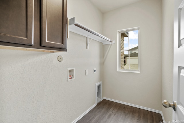 washroom with dark hardwood / wood-style flooring, electric dryer hookup, cabinets, and hookup for a washing machine