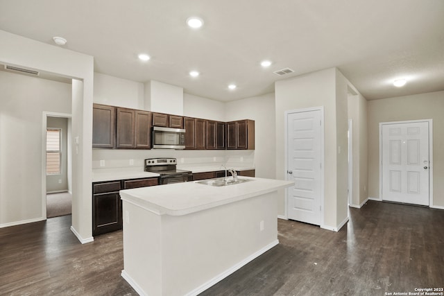 kitchen featuring dark hardwood / wood-style flooring, sink, stainless steel appliances, a center island with sink, and dark brown cabinets