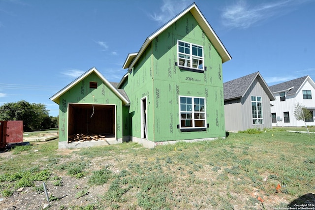 exterior space featuring an outdoor structure and a detached garage