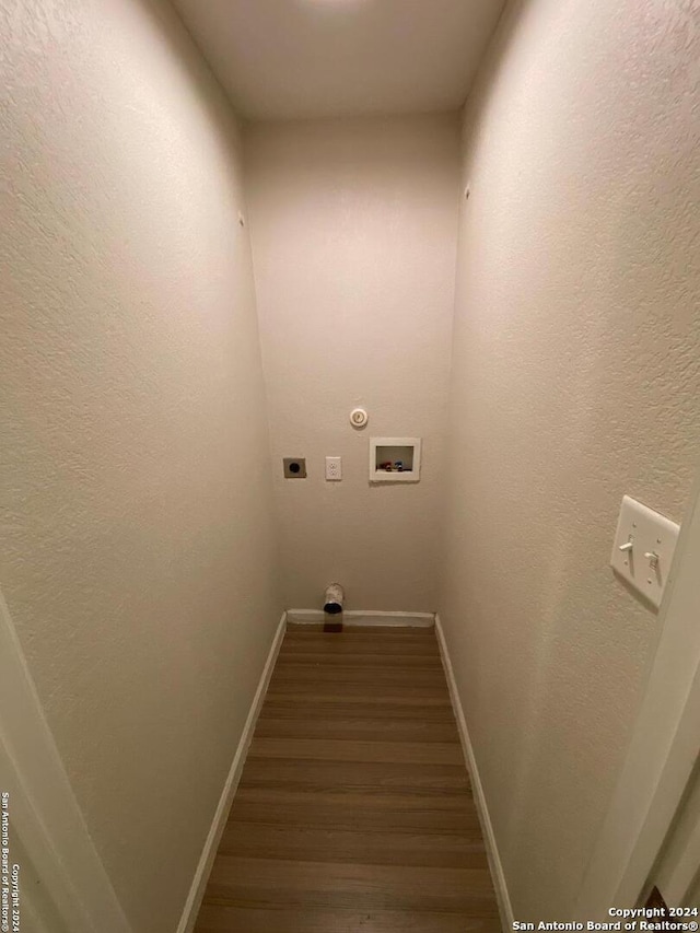 laundry area with electric dryer hookup, baseboards, wood finished floors, and hookup for a washing machine