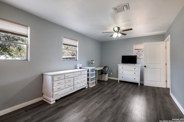 office space with ceiling fan and dark hardwood / wood-style floors