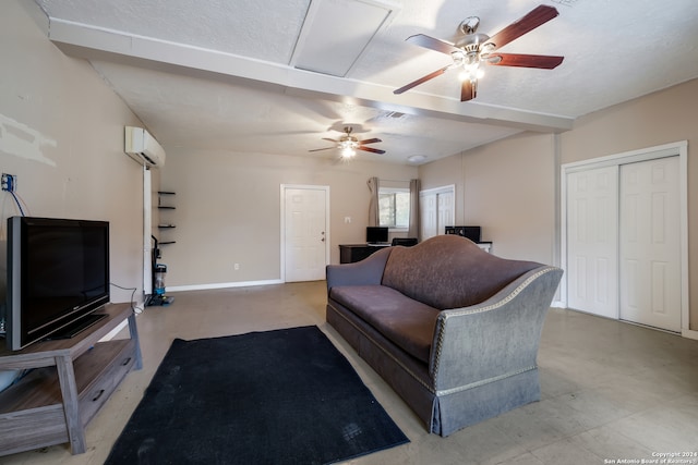 tiled living room with ceiling fan, a textured ceiling, and a wall unit AC