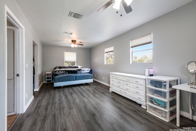 bedroom featuring ceiling fan and dark wood-type flooring