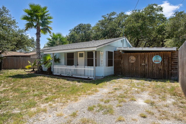 view of front of home featuring a porch and a front yard