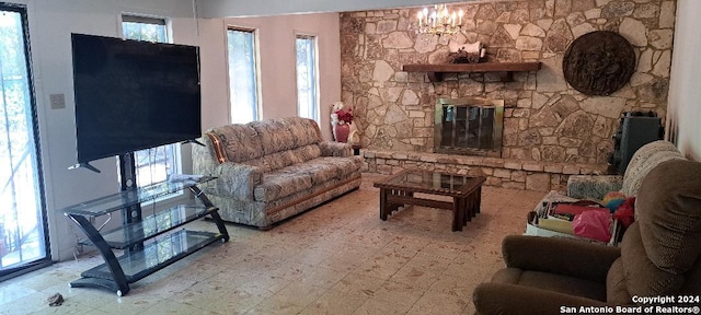 living room with a wealth of natural light and a chandelier