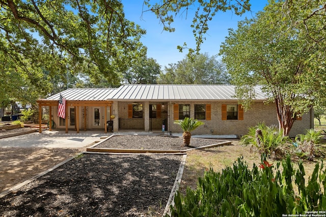 ranch-style house with a patio