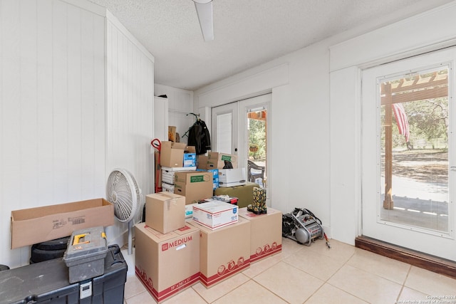 interior space with ceiling fan