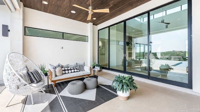 interior space featuring ceiling fan and wood ceiling