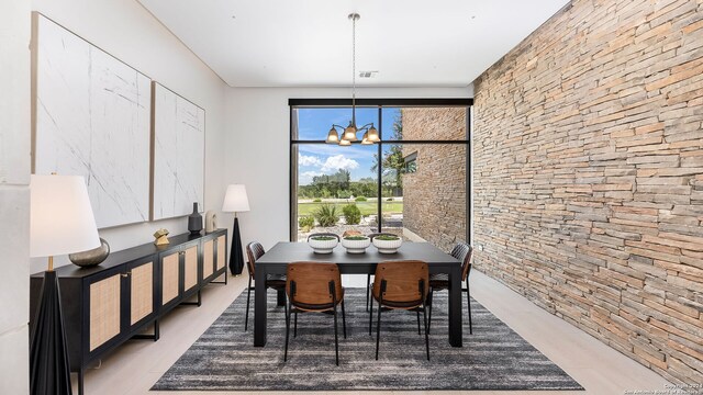 dining room featuring a notable chandelier and light wood-type flooring