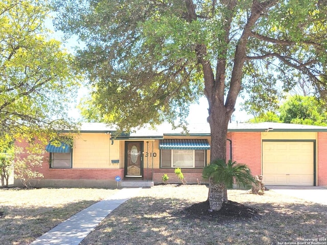 ranch-style house featuring a garage