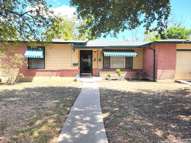 ranch-style home with a garage