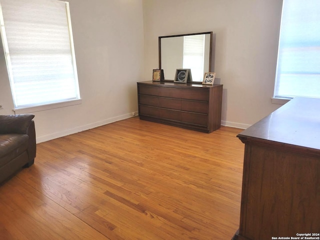 bedroom with light hardwood / wood-style floors