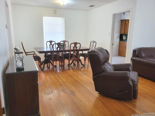 dining space with light hardwood / wood-style floors