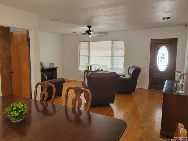 dining space featuring hardwood / wood-style floors and ceiling fan