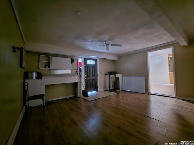 unfurnished living room with ceiling fan and hardwood / wood-style flooring