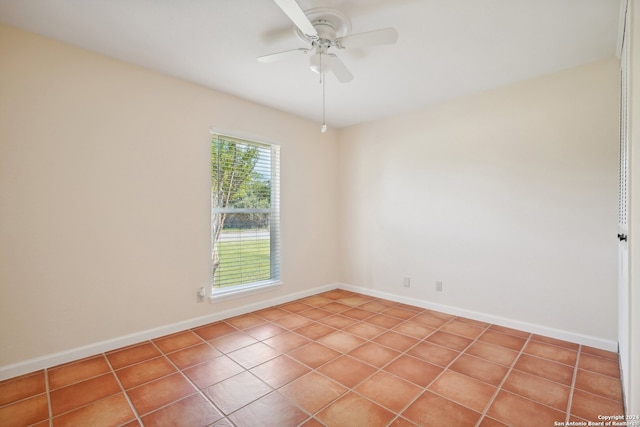 unfurnished room featuring ceiling fan and tile patterned flooring