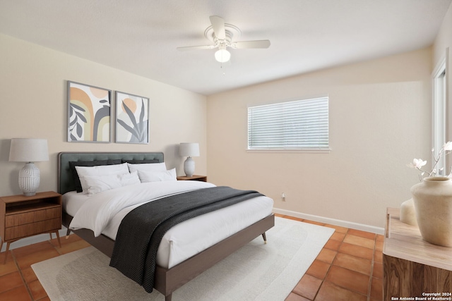 bedroom featuring ceiling fan and tile patterned flooring