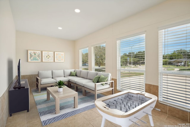 living area featuring light tile patterned flooring and recessed lighting