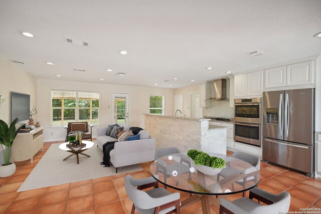 dining area featuring light tile patterned floors and sink