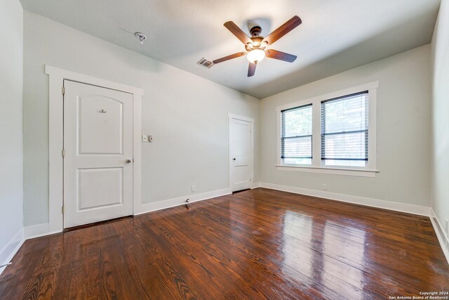 empty room featuring ceiling fan and wood-type flooring