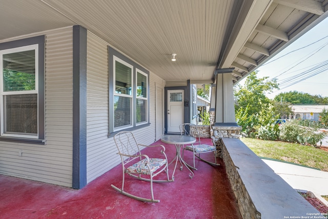 view of patio featuring a porch