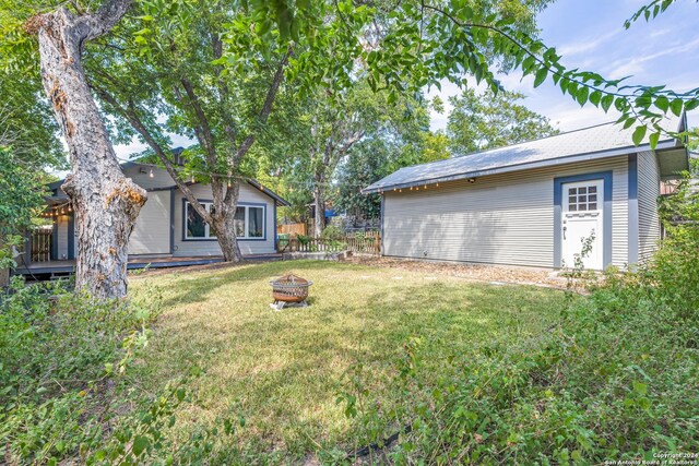 view of yard with a fire pit